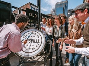 Crowd outside of Old Forester around drummer