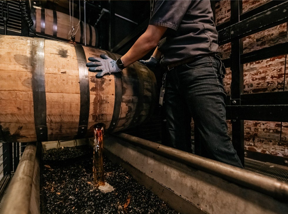 Old Forester Single Barrel Whisky pouring from barrel