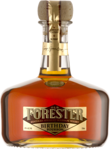 A bottle of Old Forester 2011 Birthday Bourbon on a black background.