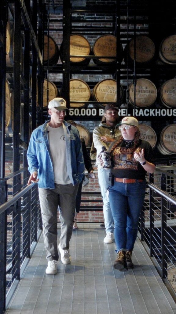 A group touring the Old Forester Distillery